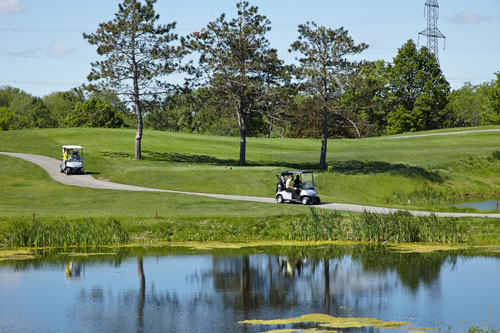 Event Photography for Tim Hortons golf tournament golf carts driving on course by Bochsler Photo imaging