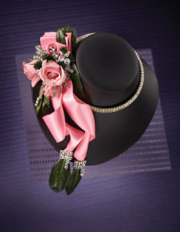 Flower Garland Photography for Annex Publishing pink flower on black hat Prom Corsage Arrangement