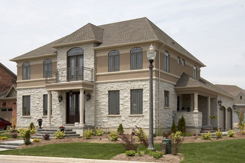 Residential Photography exterior stone and stucco Pollard Windows