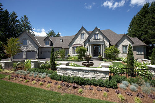 Residential Photography exterior garage doors brown with front lawn Pollard Windows