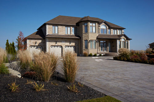 Residential Photography grey exterior and front lawn Pollard Windows Canada