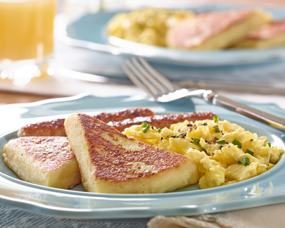 Breakfast food photography at kitchen table with orange juice