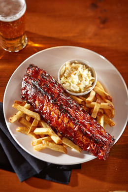 On-location entree food photography for Jake's Grill & Oyster House full rack of baby back ribs