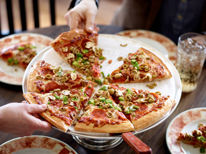 On site pizza photography for Mother's Pizza with olives, mushrooms, peppers, pepperoni and cheese