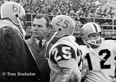 Tom Bochsler Art of Industry Hamilton Tiger Cats coach Ralph Sazio with players John Barrow, Tim Reid and Jim Whetham from 1962