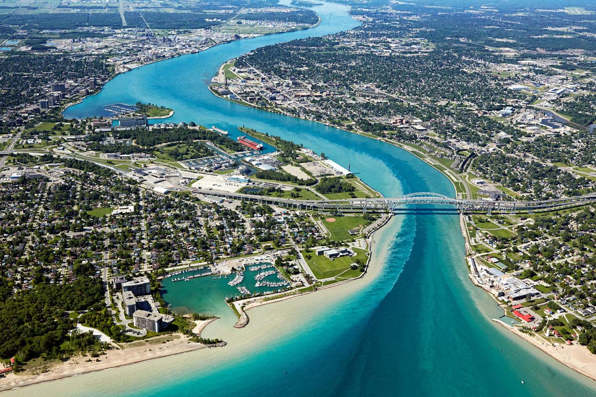 Aerial Photography of city river highway bridge crystal blue water