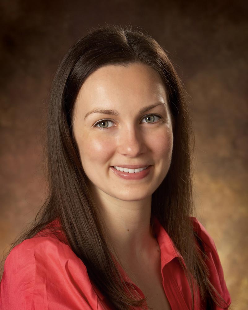 Toronto Business Portrait Photographer female businessperson on brown background