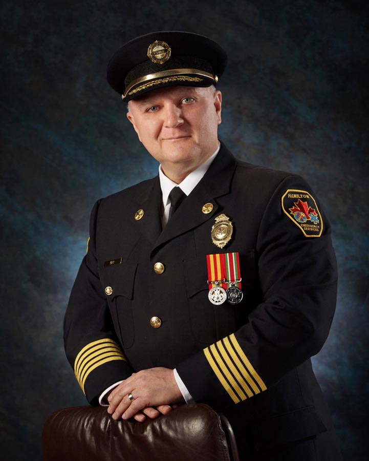 Hamilton Executive Portrait Photographer EMS captain on dark background