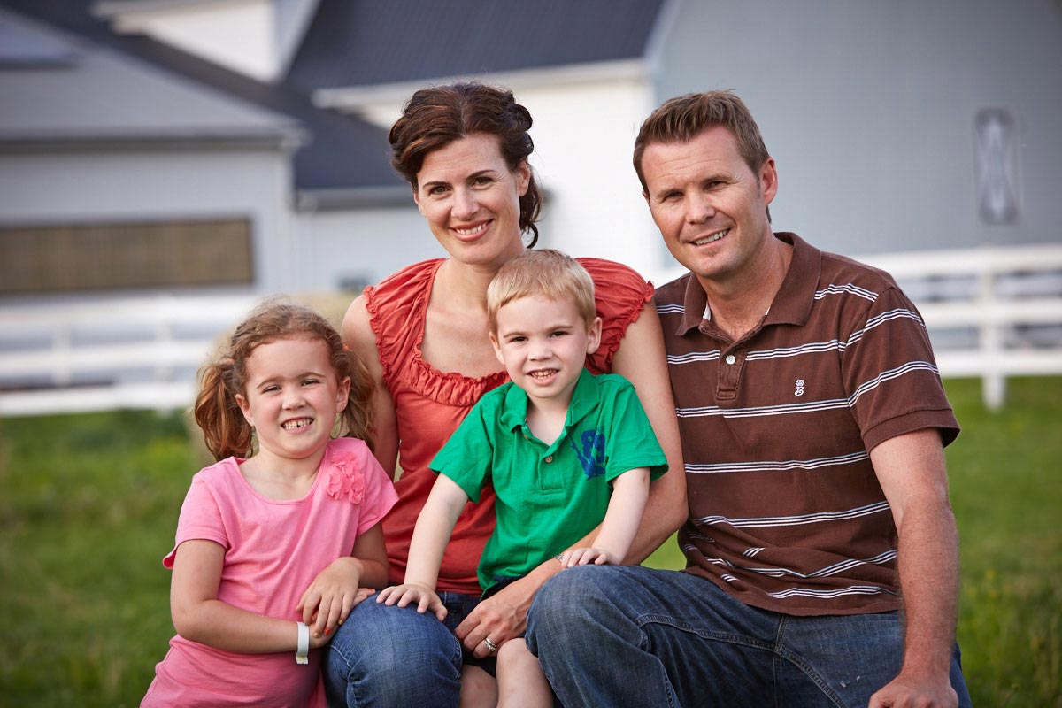 Farm Family Portrait Photographer parents and children on farm in Ontario