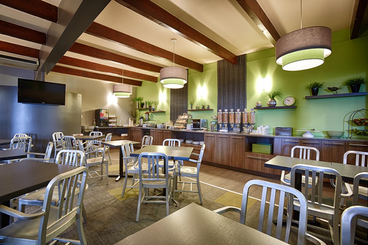 Hotel Interior Photography of cafeteria area with TV and metal wooden accents