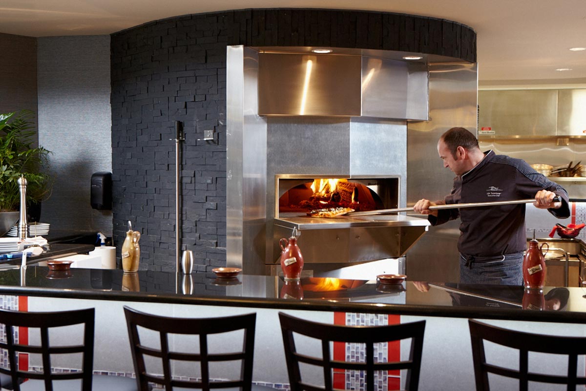 Hotel Amenities Photography of chef pizza oven in cafeteria bar