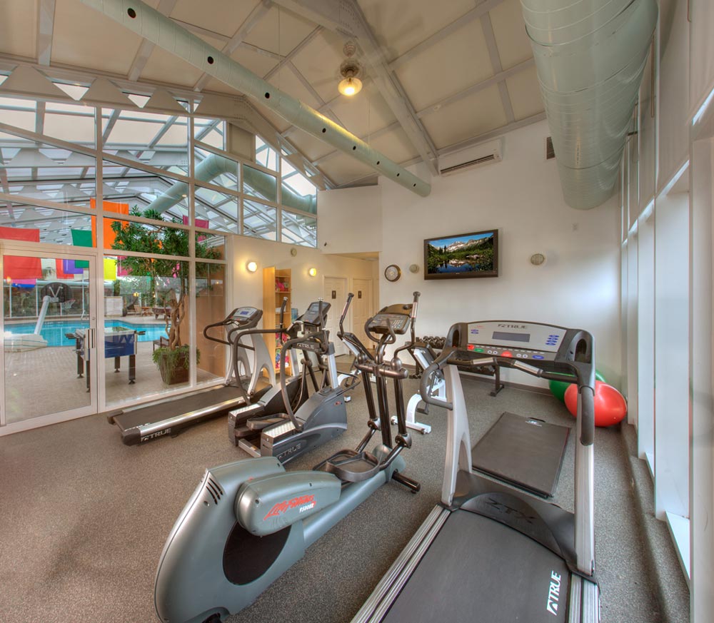 Hotel Fitness Centre Photography of treadmill, elliptical and television