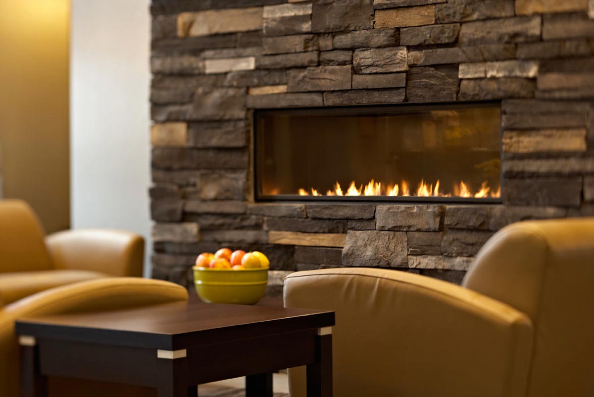 Interior Hotel Photography of leather lounge seating and fireplace