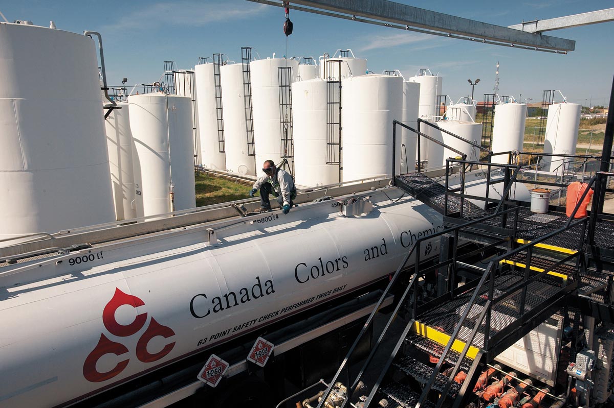 Industrial Outdoor Photography of loading chemicals into tank