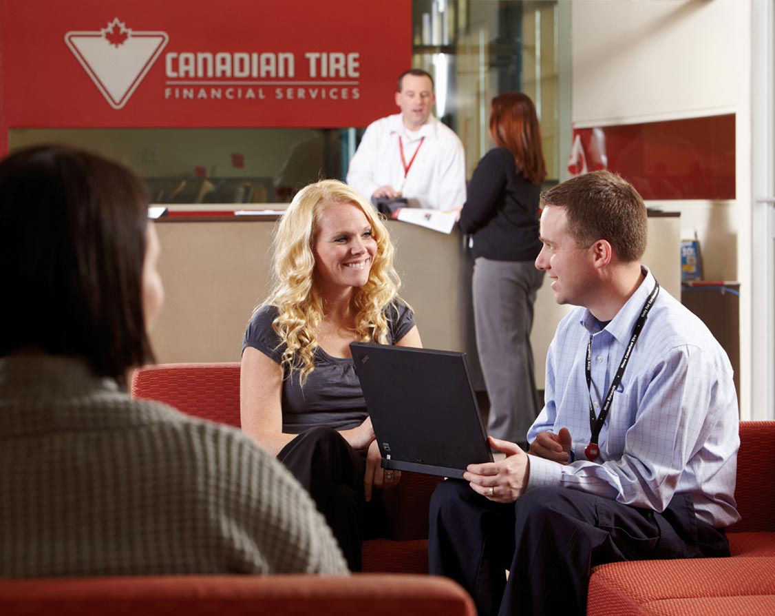 Lifestyle Photographer Canadian Tire Financial Services employee servicing customer