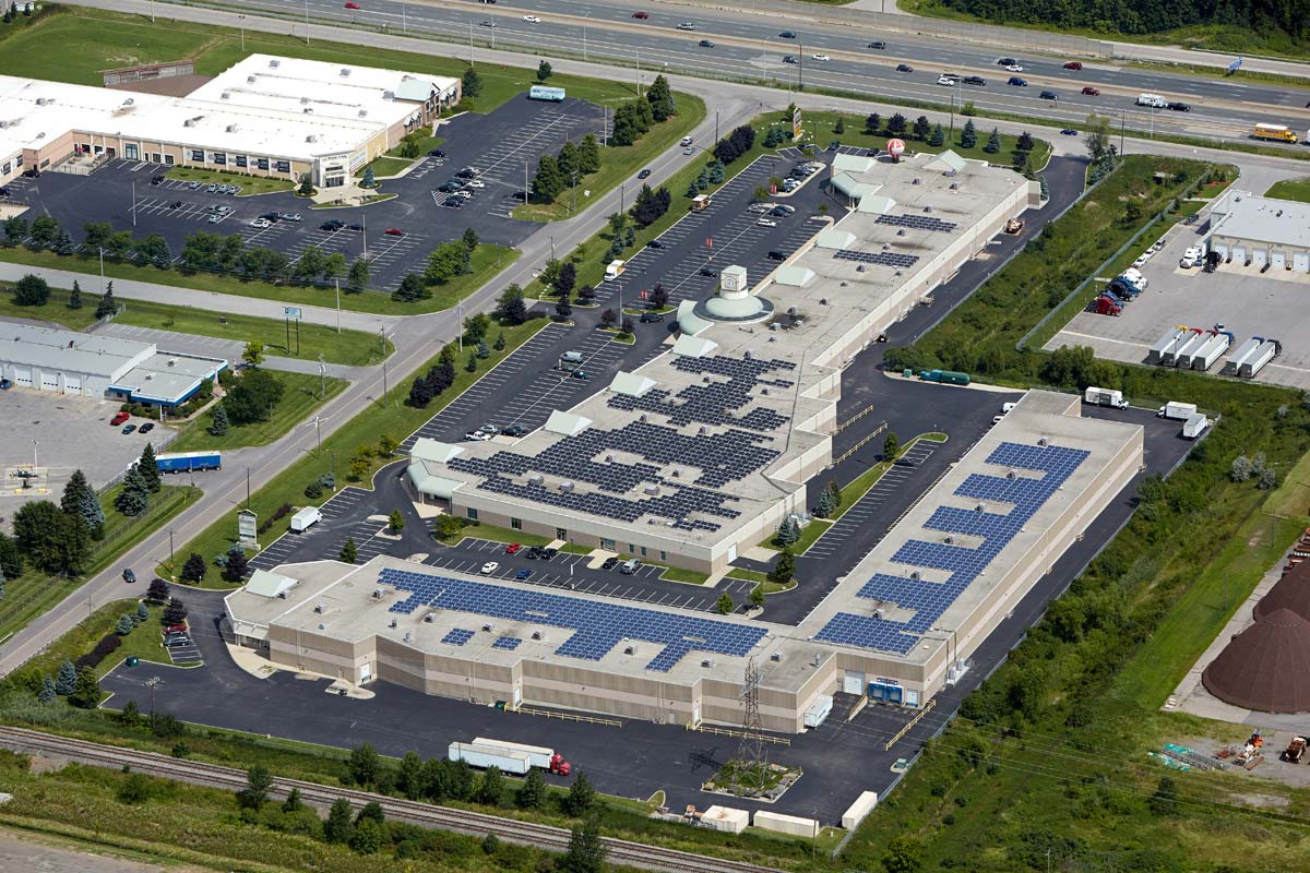 Aerial Photographer of office and warehouse with solar panel roofing