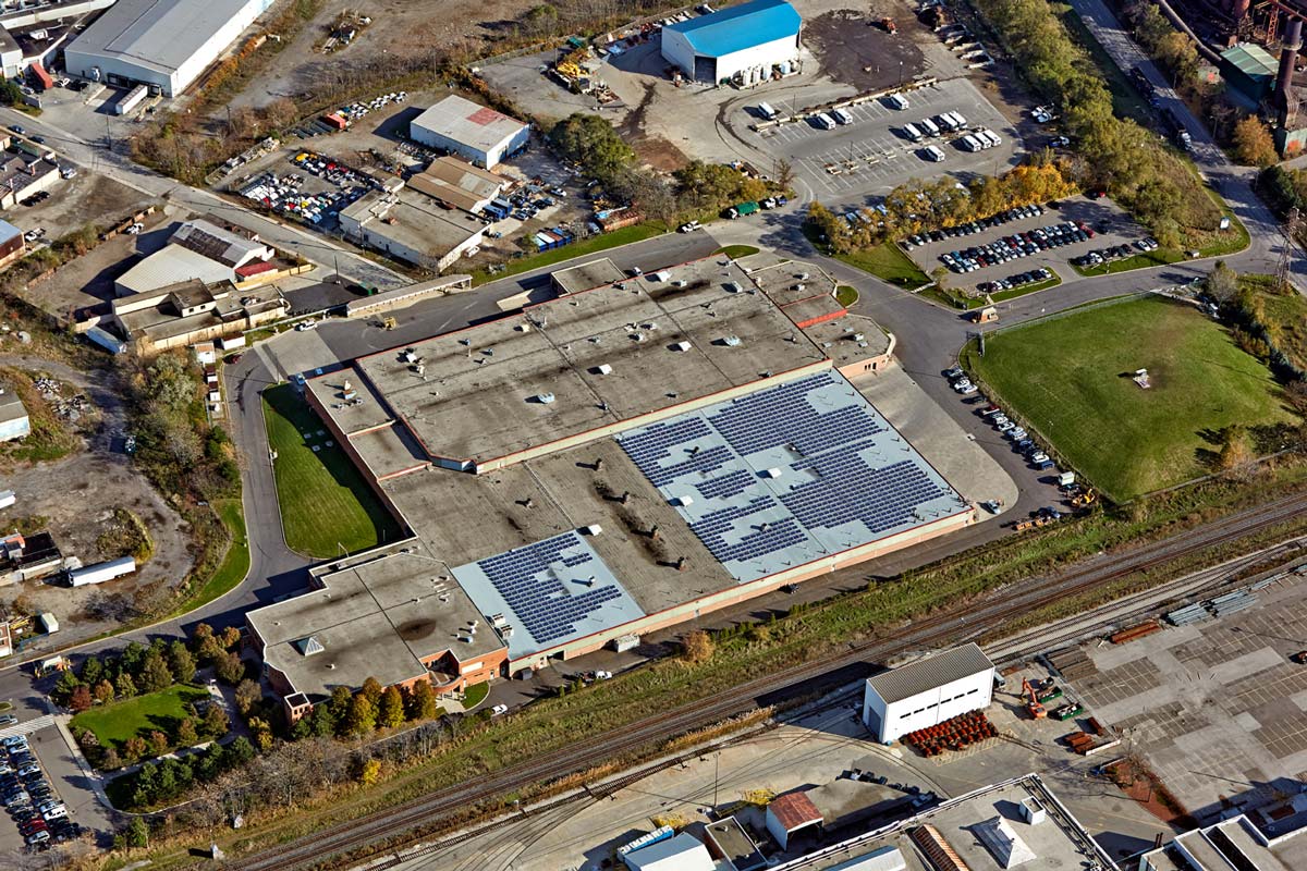 Aerial Photography of warehouse with solar panels on roof