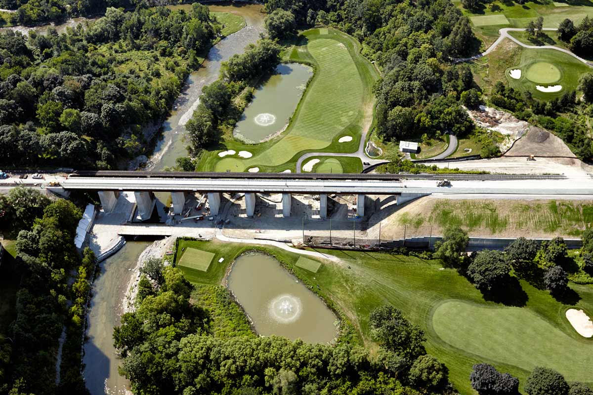 Aerial photography of bridge construction and golf course