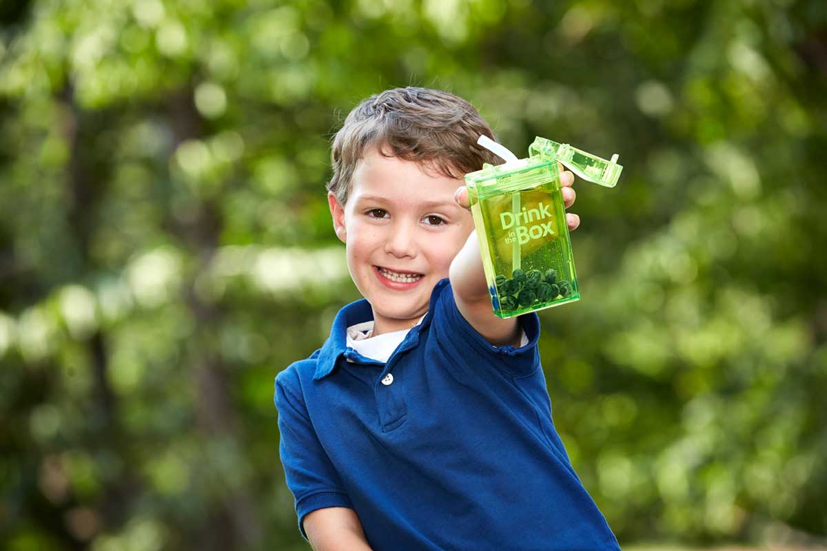 Lifestyle photography of child with product Drink in the Box