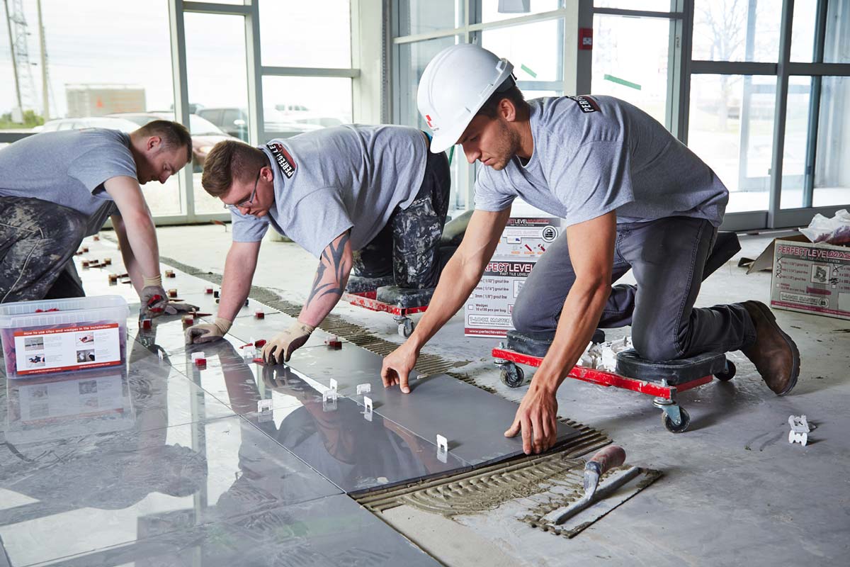 Industrial photography of workers installing modern floor