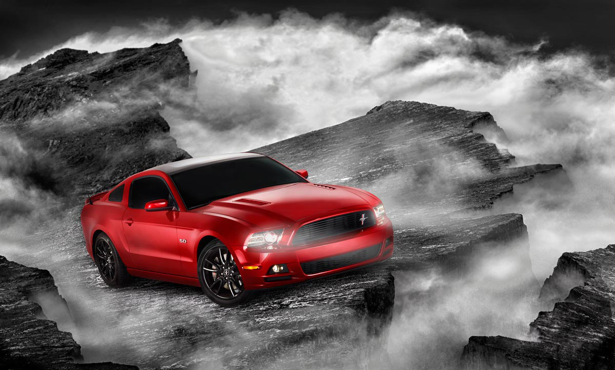 Illustrative Photo - Red Ford Mustang Car Smokey Rock Cliffs