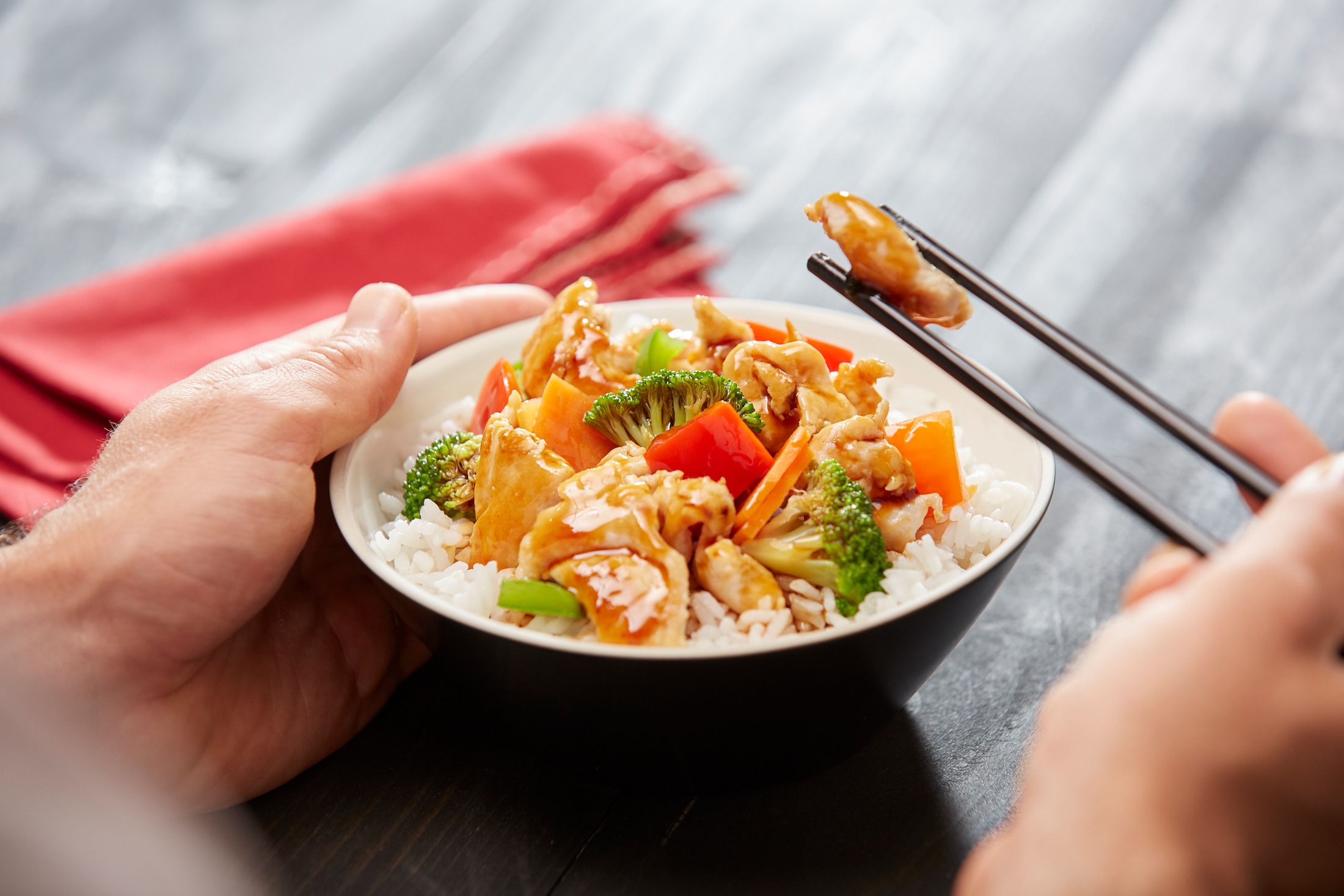Food Photo - Lady Eating Teriyaki Chicken Rice With Chopsticks