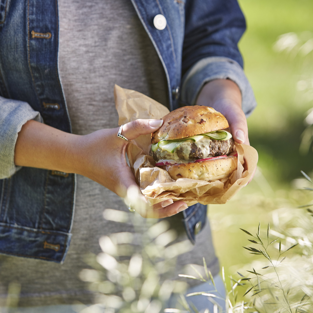 Food Photo - Women Outside Holding Lamb Kofta Burger