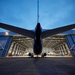 Industrial Photo - Night View Airplane Entering Hanger