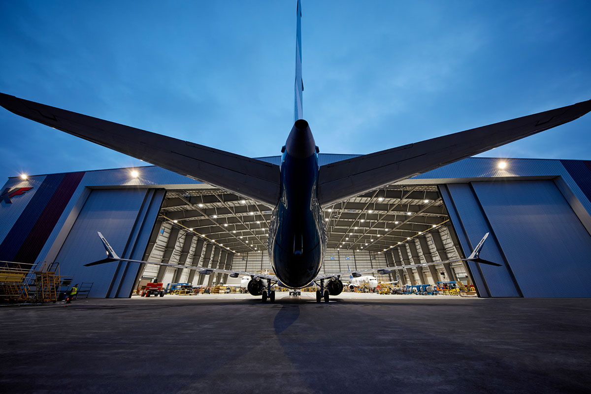 Industrial Photo - Night View Airplane Entering Hanger